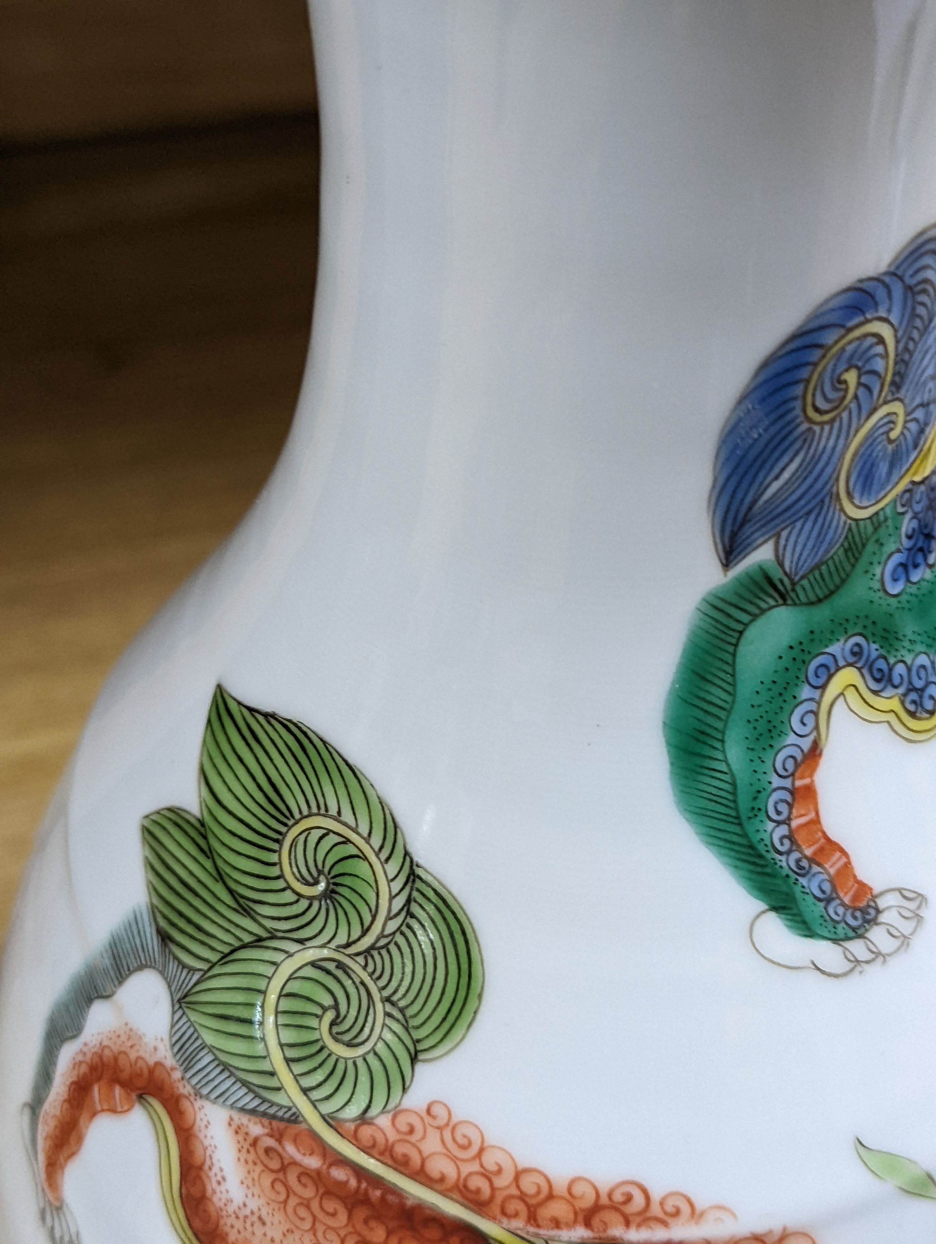 A Chinese famille verte pear-shaped ‘Buddhist lion’ vase, on stand, 32 cms high not including stand